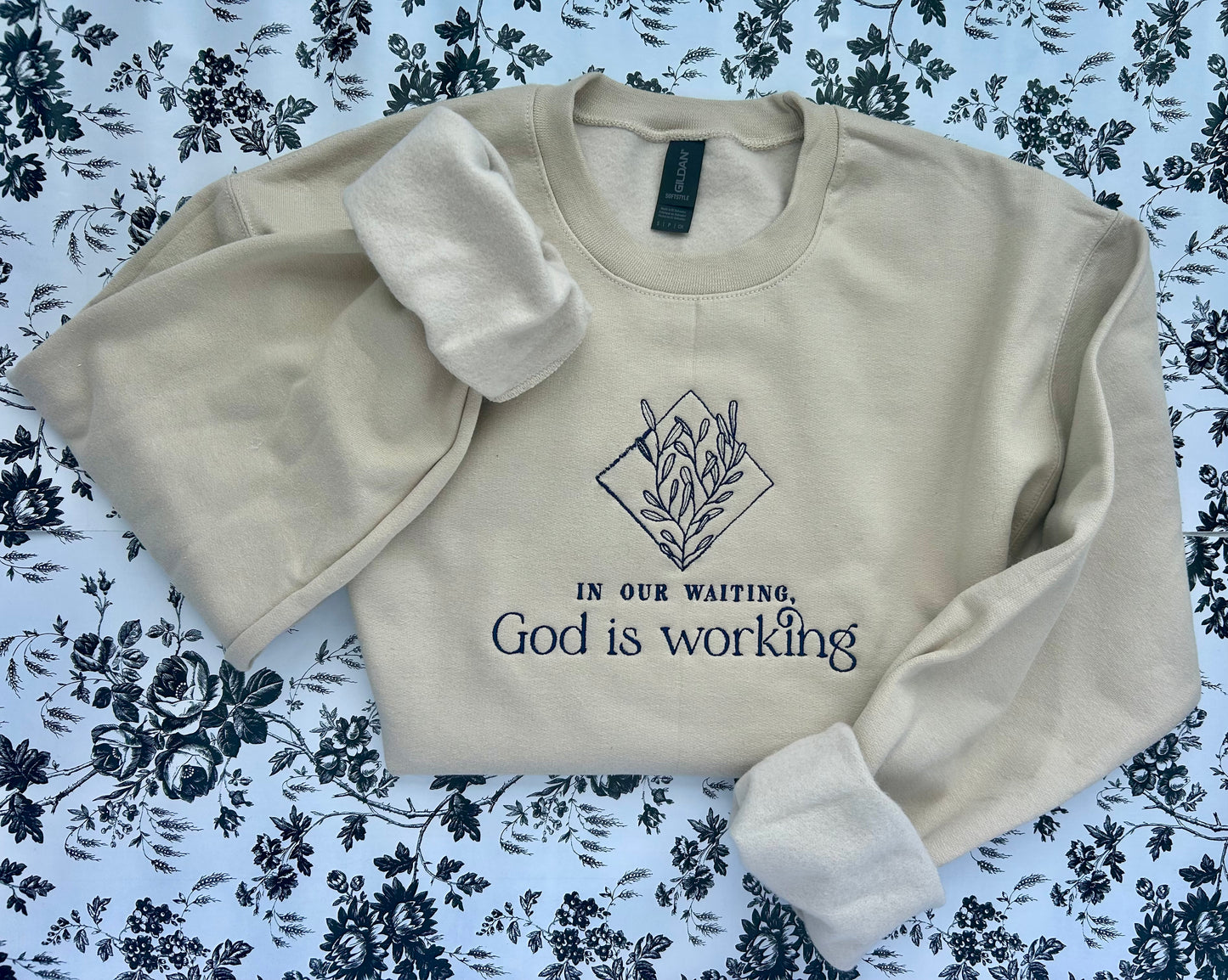 “In Our Waiting God is Working” Embroidered Soft Style Gildan Crewneck Sweatshirt